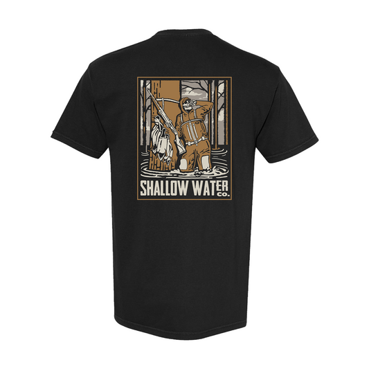 Back view of the Shallow Water Co. Killing Time Tee featuring a skeleton duck hunter standing in flooded timber, holding a shotgun and a strap of ducks; printed on a black short sleeve Comfort Colors shirt.